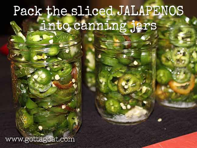 Pack the jalapeños in canning jars