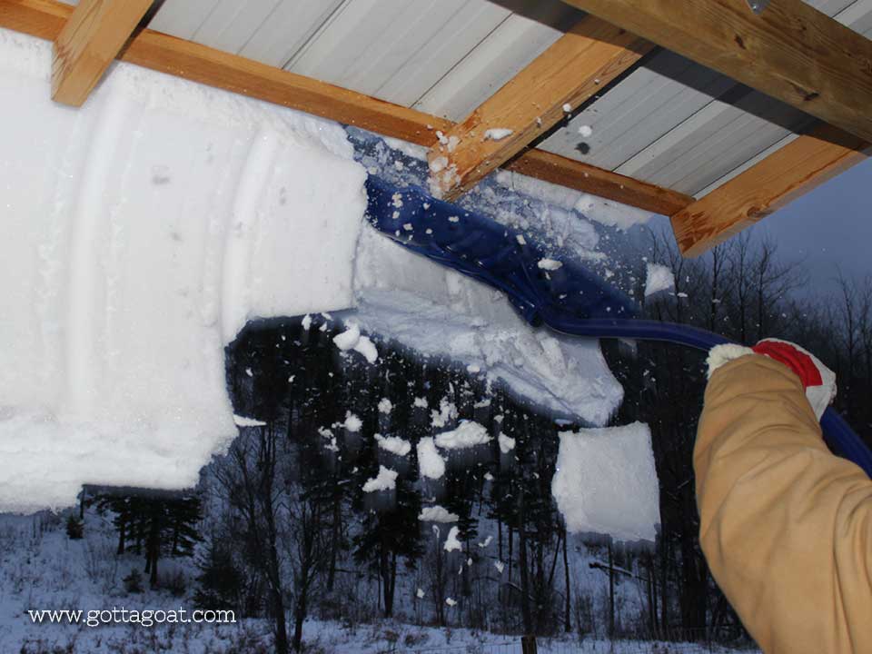 Knocking the snow off the roof